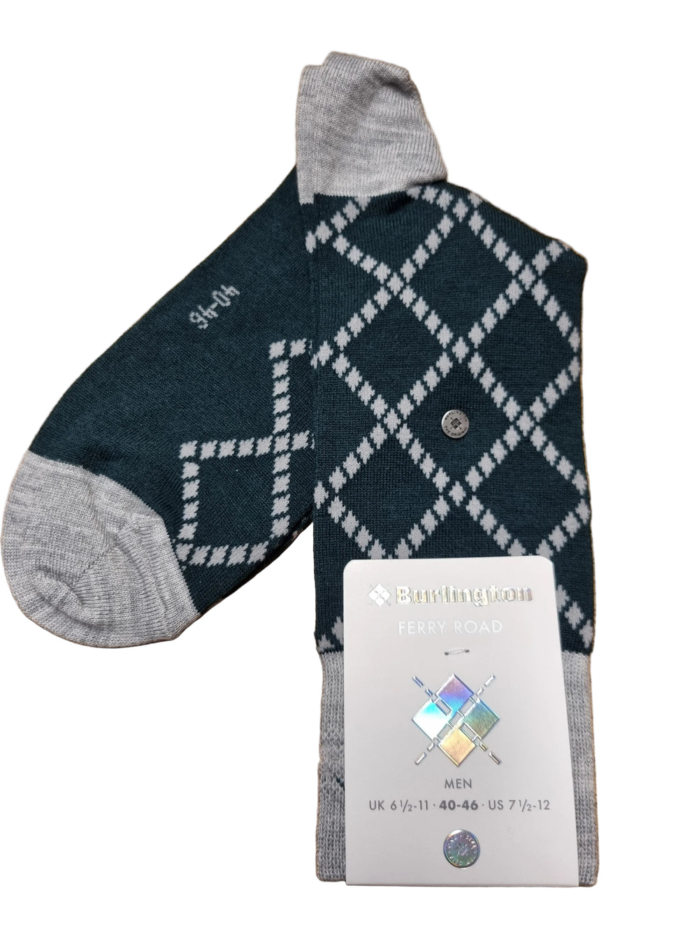 A single knit sock laid on a wooden surface, shown with its retail tag. The sock has a dark teal body with a white argyle diamond pattern and light gray cuffs, heels, and toes.