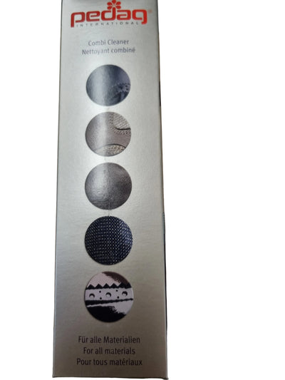 A tall rectangular Pedag Combi Cleaner box standing on a wooden tabletop. The packaging is metallic silver with red Pedag branding at the top and five circular material-use icons printed vertically in dark gray and black.