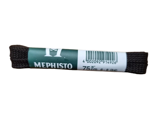 A pair of black braided shoelaces with a green and white paper label wrapped around them, placed on a wooden surface. The label shows the brand name 'MEPHISTO'.
